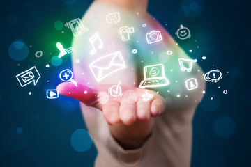 Young woman presenting colorful social media icons