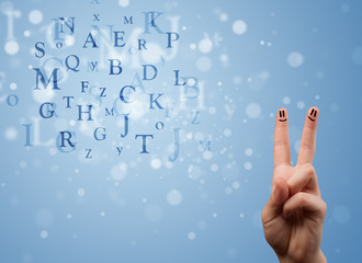 Happy smiley fingers looking at mixture of bokeh letters