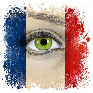 France flag painted on face with green eye