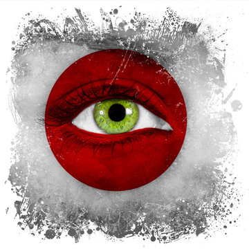 Japan flag painted on face with green eye