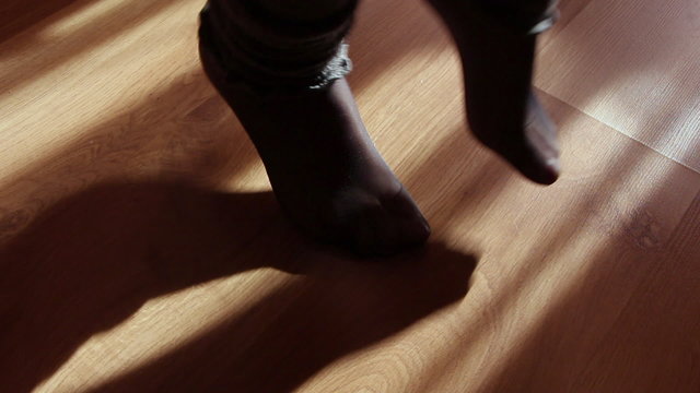 Close up of a female feet doing exercises indoors