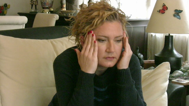 Woman having sinus pain