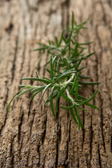 Sprigs of rosemary on an old board.