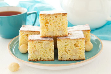 Sweet cake brownies (blondie) with macadamia nuts.