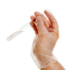 Hand in latex gloves holding test-tube with white powder