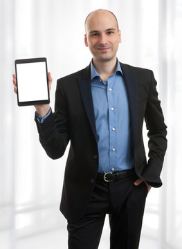 Businessman Presenting Something On A Tablet