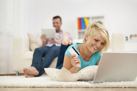Smiling woman and online shopping at home