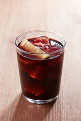 Kalimotxo glass on wooden table