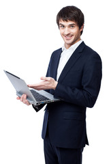 Young businessman use laptop on white background.