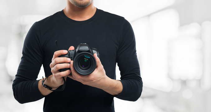 Photographer holding a camera