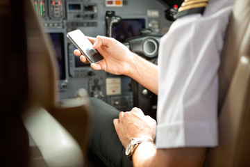 Pilot Using Cell Phone In Cockpit