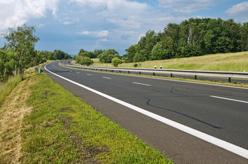 Empty highway passing landscape