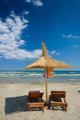 Beach chair on White sand blue sea background