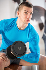 Fototapeta na wymiar muscle man with weights