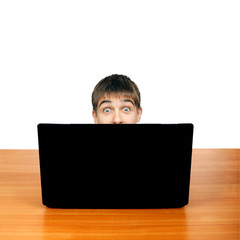 Surprised Teenager behind Laptop