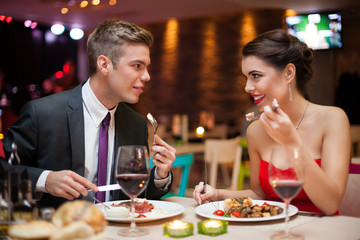 man and woman having a romantic meal