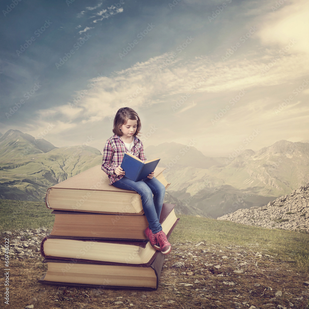 Wall mural girl reading a book