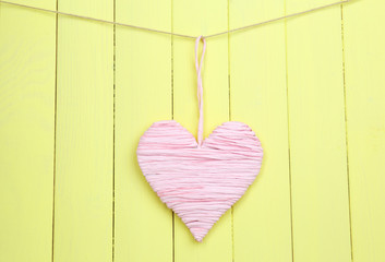 Decorative heart on wooden background