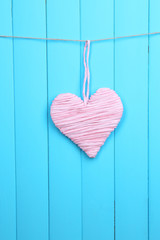 Decorative heart on wooden background