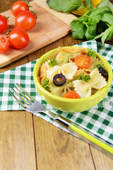 Delicious pasta with tomatoes on plate on table close-up