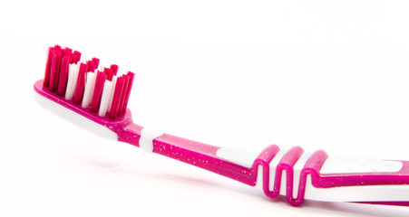 Pink toothbrush isolated on white