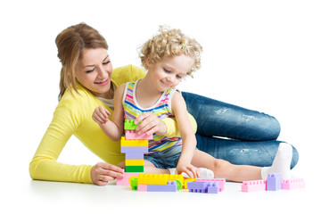 kid and mother play toys together
