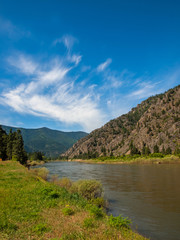 Fototapeta na wymiar Wide Mountain River Cuts a Valley - Clark Fork River Montana USA