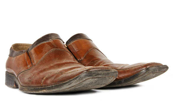 Old brown shoes isolated