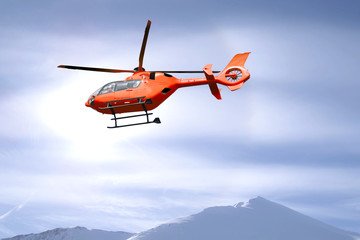 Fototapeta na wymiar Rescue helicopter over mountain summits