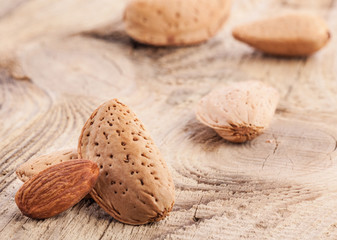 Almond nuts on very old wooden table, closeup