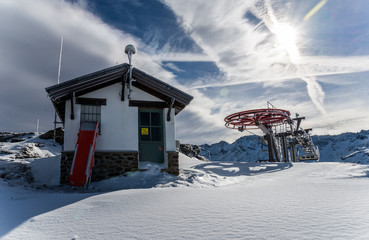 Chairlift with mountain shelter