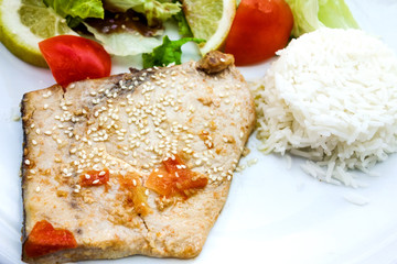 close-up of plate of rice and smoked salmon with tomato