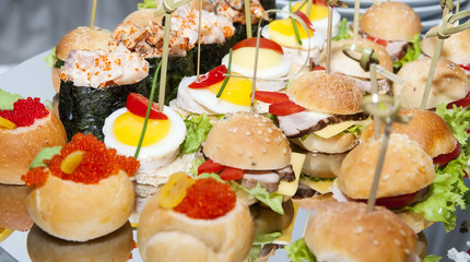 canape with meat vegetables and seafood