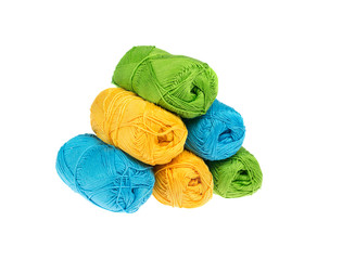 Pyramid of colored yarn isolated on white background