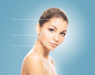 Portrait of a young woman with dotted arrows on blue