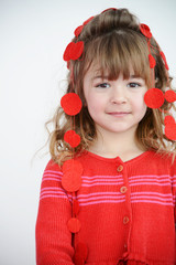 Beautiful girl in red and festive garland behind
