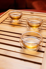 Three cups on a wooden tray
