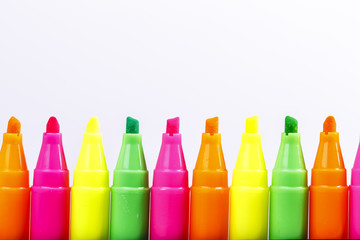 Group of felt tip bright color markers on white background