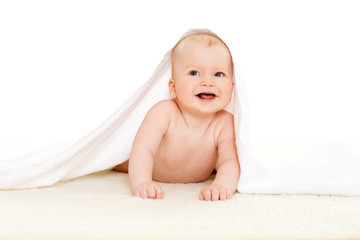 Sweet small baby with  towel.