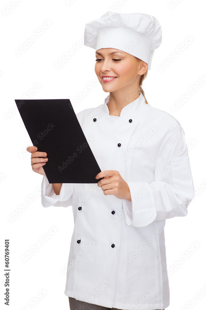 Poster smiling female chef with black blank paper