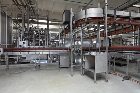 The interior of brewery, conveyor line for the bottling of beer