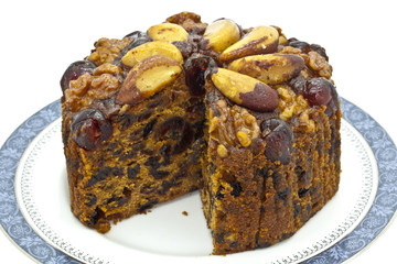 Rich fruit cake decorated with nuts.