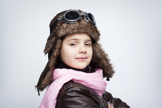 Portrait Of A Pilot Child Against Gray Background