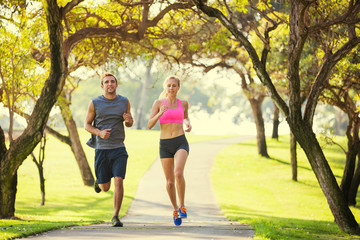 Couple running in park