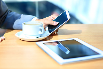 Modern workplace with digital tablet computer and mobile phone