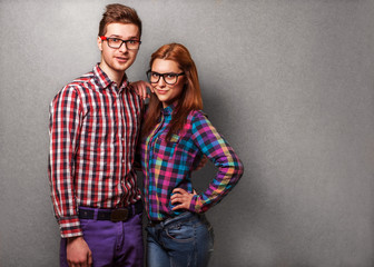 couple of guys dressed in clothes hipsters are in the studio