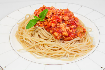 Spaghetti with tomato sauce on a plate.