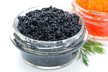 black caviar in a glass jar, close-up, isolated
