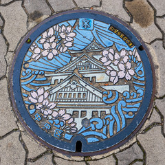 The Osaka castle engraved on to a manhole cover