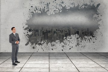 Composite image of businessman with hands folded